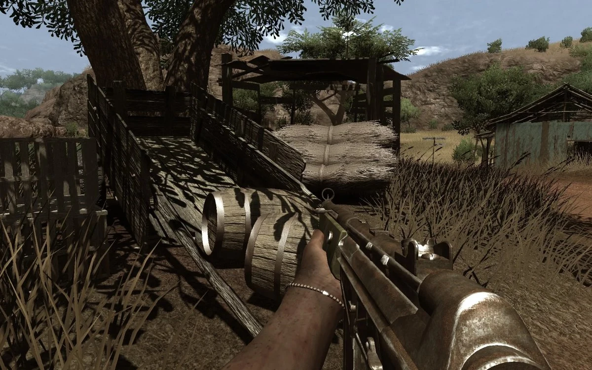 Far Cry 2 diegetic navigation - first-person view of player holding a paper map and GPS device while driving