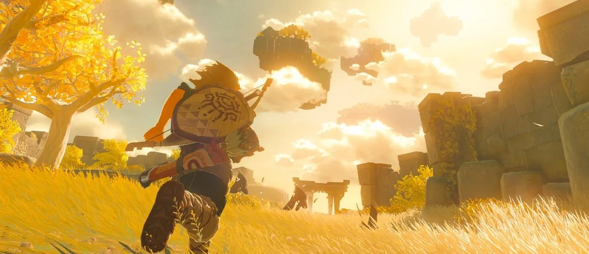 Fantasy environment art of a hero in a yellow autumn meadow watching floating rock islands rise into a sunlit cloudy sky, in the style of The Legend of Zelda: Breath of the Wild