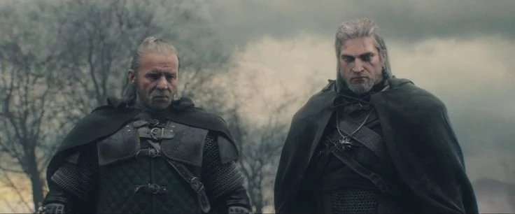 Cinematic still of two grizzled armored swordsmen in dark cloaks standing on a misty plain under a grey sky, from The Witcher 3
